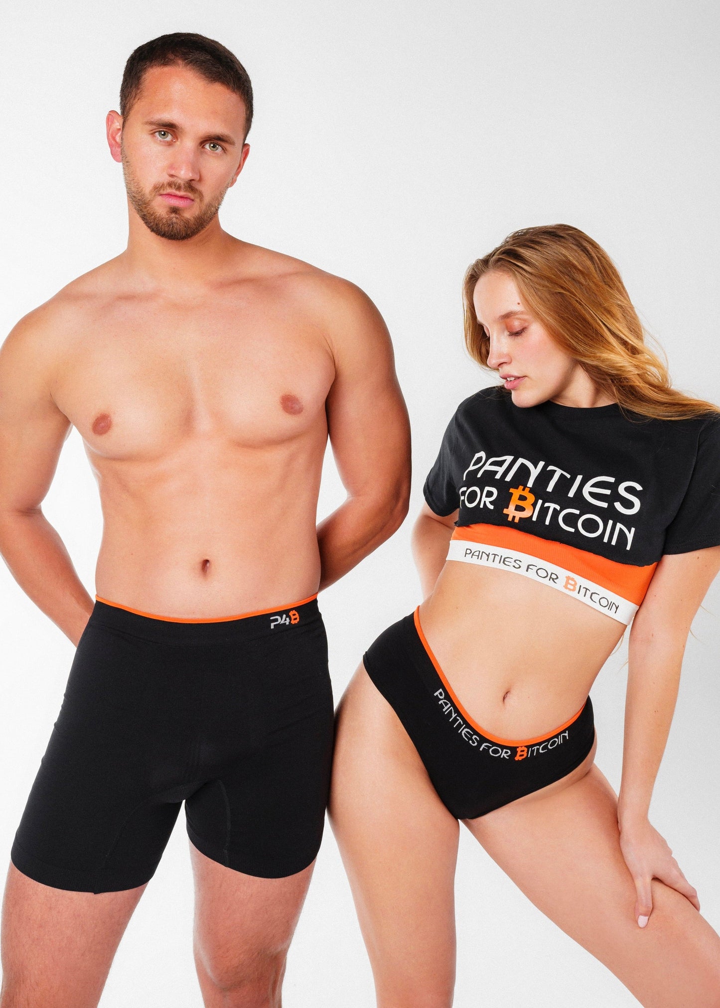 Male model wearing the Genesis Boxer and female model wearing the New Genesis Hipster with the Genesis Bra and Panties for Bitcoin t-shirt, showcasing the Genesis Him & Her Bundle